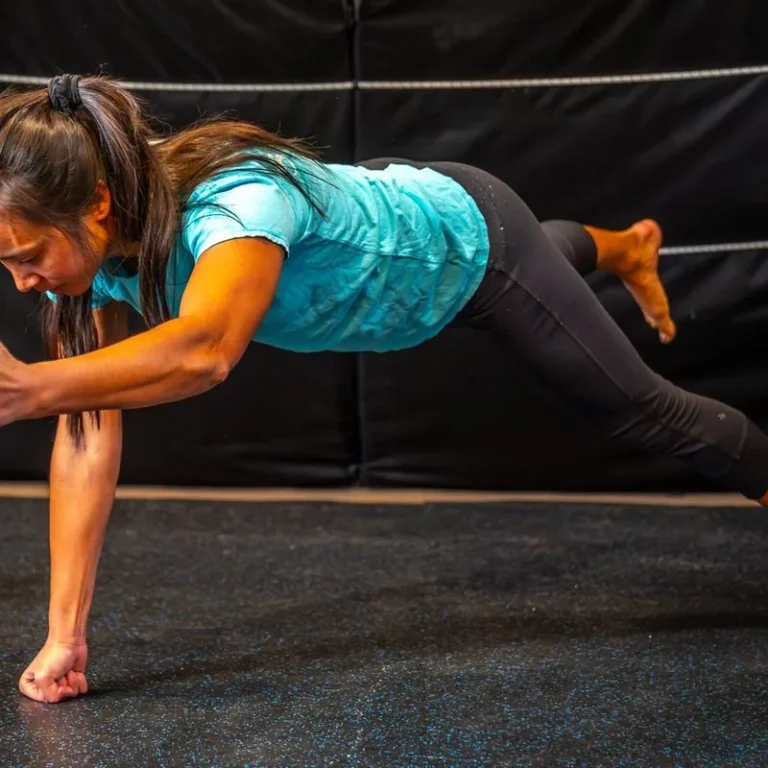 Athlete holding a plank with one arm and one leg lifted