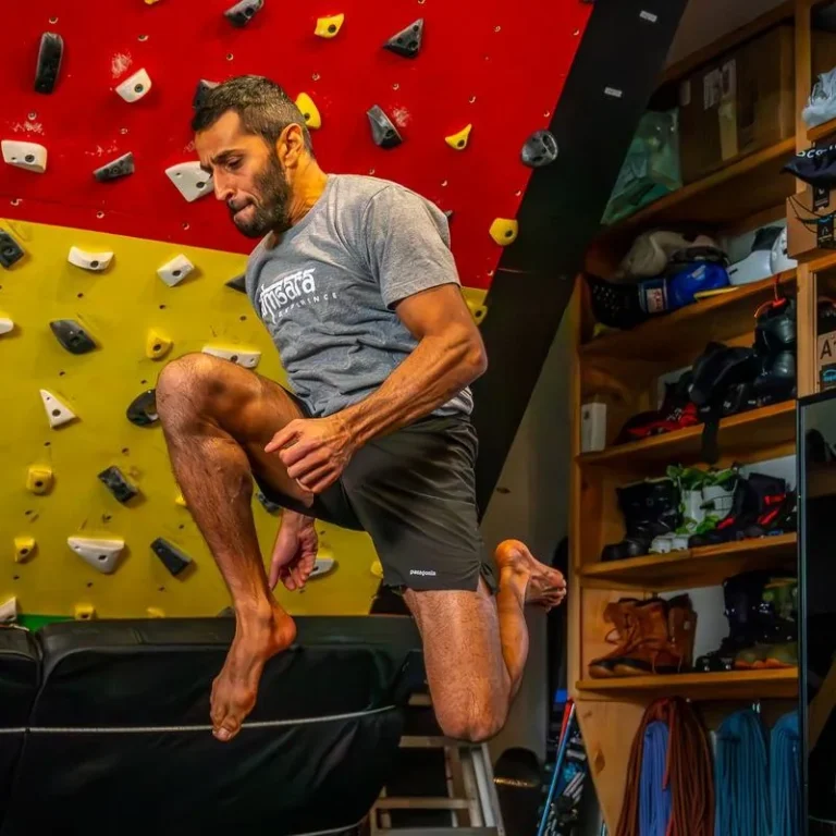 Athlete mid-air in a plyometric jump with knees driven up